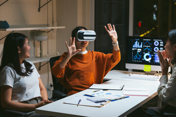 Business team exploring virtual reality in office, analyzing graphs and data with innovative technology