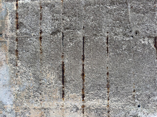 Weathered Concrete Texture with Rust Stains and Exposed Rusty Rebar, Eroded by Sea Air and Moisture