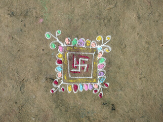 Hand Drawn Indian Rangoli Colorful Art Drawn on a Clay Ground
