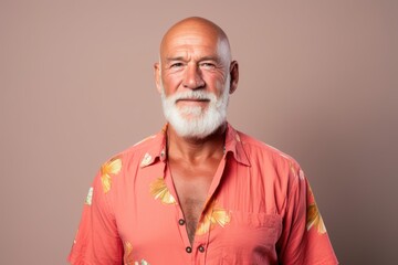 A man with a beard and a red shirt is smiling
