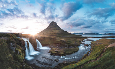 Breathtaking Kirkjufell mountain and Kirkjufellsfoss waterfall on the Snaefellsnes Peninsula, Iceland, near Grundarfjordur, with a stunning sunset backdrop