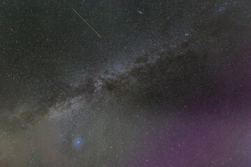 Mesmerizing view of the Milky Way galaxy stretches across the night sky, dotted with countless...