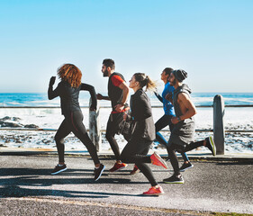 People, fitness or running with beach for cardio workout or exercise together on promenade. Active...