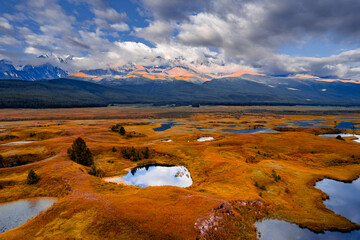 Beautiful landscape autumn lake Dzhangyskol with reflection of mountains Altai, aerial view