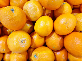 Chinese navel or Valencia oranges background close up 