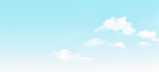 Blue pastel sky with white fluffy cloud. Cloudscape background. Autumn, Summer, Spring time season sky. Peaceful Calm Relaxation Freedom of life and Positive Energy Concepts. Copy space.