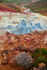 Colorful soil due to active fumaroles in Krysuvik-Seltun Geothermal Hot Springs area in Iceland.