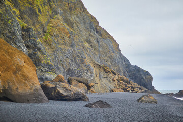 Basalt rock formations on Reynisfjara Black Sand beach near Vik in Iceland