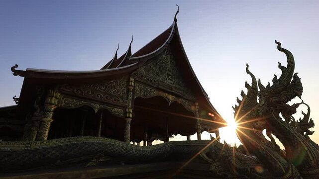 Background of the video of a religious tourist attraction, Wat Phra That Nong Bua, Ubon Ratchathani Province, Thailand. The beauty of the temple and the beautiful sculptures.