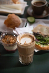 cup of coffee with milk and cookies