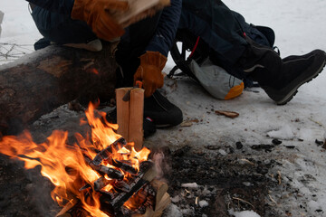 person working on a campfire