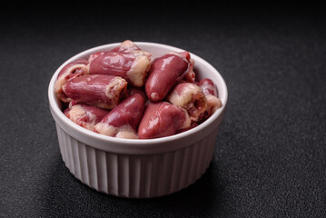 Raw chicken hearts with salt, spices and herbs