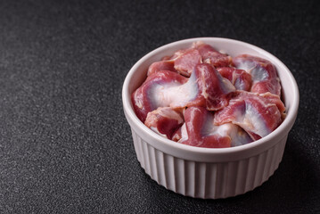 Raw chicken or turkey gizzards with salt, spices and herbs
