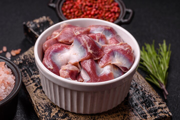 Raw chicken or turkey gizzards with salt, spices and herbs