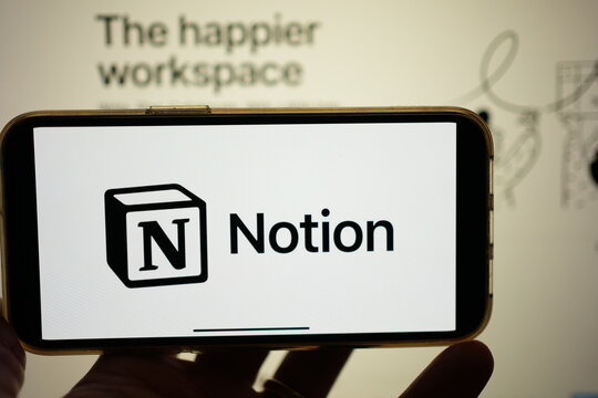 Roosendaal, The Netherlands - February 2, 2025: A mobile phone screen displaying the logo of Notion, an all-in-one customizable project management app, with the company website in the background.