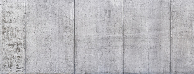 Industrial Concrete Wall Texture: A close-up of a textured concrete wall with vertical lines,...
