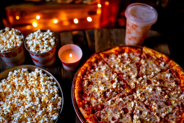 Vintage-style movie night with pizza and popcorn. 