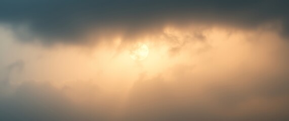 Fototapeta premium Light breaking through clouds at dusk over a calm horizon