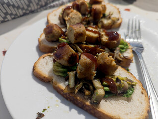 Vegan breakfast. Vegan sausage, mushroom and avocado on bread