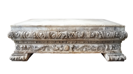 This exquisite marble table features detailed carvings around its edges and a smooth top. It stands alone in an isolated area, emphasizing its artistic craftsmanship and unique design