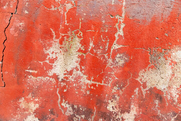 Weathered Red Wall With Cracks and Textured Paint Detail