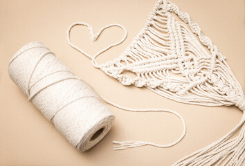 macrame and cotton threads on light background, suitable for banners and advertising of macrame and...