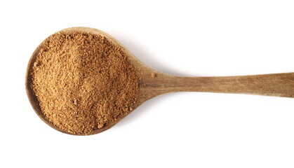 Pile ground, milled nutmeg powder in wooden spoon isolated on white, top view