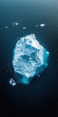 Fototapeta premium Aerial view of drifting icebergs in the cold ocean, a stunning natural scene with crystal-clear water and ice textures, perfect for themes of ecology, climate, and polar landscapes
