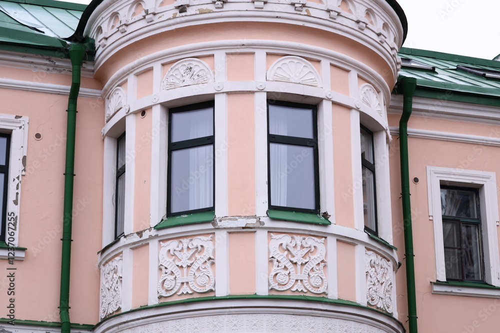 Poster A pink building with a clock face on its front, suitable for use in illustrations about architecture or timekeeping.