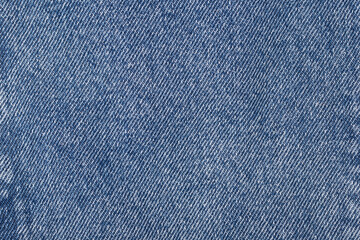 The denim is light blue. Denim background.