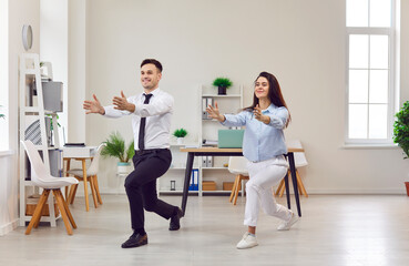 Office yoga, businessman, businesswoman doing fitness workplace in squat pose, happy meditating in modern office, feel comfort at workplace, relieving stress at work with colleague, calm successful 