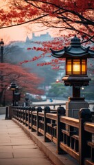 Fototapeta premium Japanese lantern in the park filled with Sakura