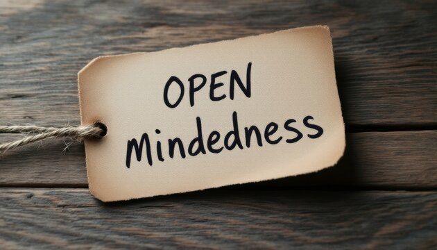 Aged tag presenting the notion of open-mindedness resting on wooden planks