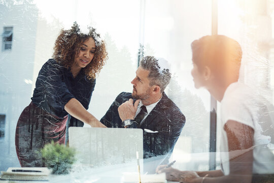 Team, double exposure and business people planning with laptop in meeting with sustainability consultant. Group, office training and discussion with manager for eco friendly project on nature overlay