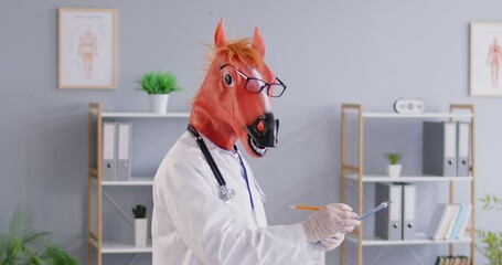 Portrait of a funny doctor, nurse, physician or surgeon wearing a horse mask and eyeglasses, writing a prescription in a hospital office setting, blending medical healthcare with humor.