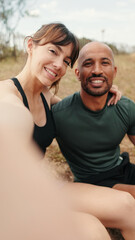 Fototapeta premium Multi-ethnic athletes, beautiful fit girl and strong man take a picture of themselves. Happy woman taking selfies with boyfriend. Content for social media in the summer. Couple goals