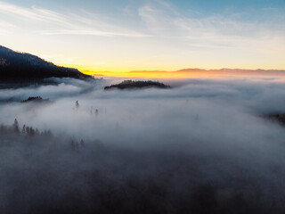 Misty morning in Liptov region with High Tatras mountains around. Liptovsky Mikulas landspace, slovakia.