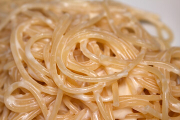 spaghetti with cottage cheese. food details. pasta with cottage cheese. food with selective focus.