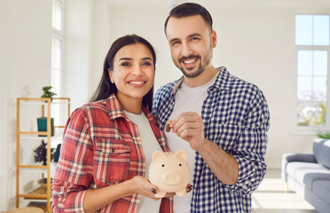 Couple or family portrait is captured sharing a moment of financial bonding. With beaming smiles, they putting a coin into piggy bank, symbolizing commitment to saving money for a brighter future.