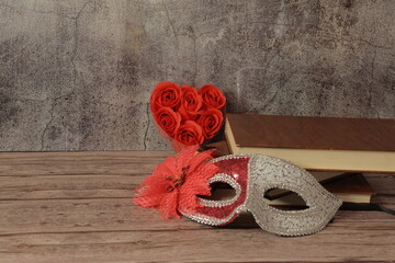 red rose on wooden background