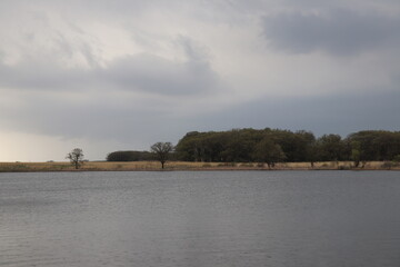 Open field in a prairie near a lake on a hike in southern Minnesota in the fall/autumn. 