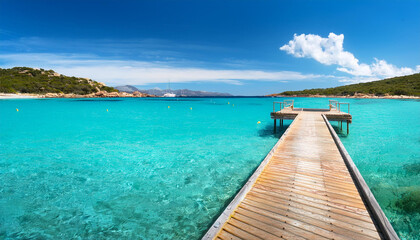 Obraz premium pontoon in the turquoise water of rondinara beach in corsica i