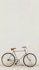 Obraz premium Vintage Bicycle Stand Against Empty Wall in Minimalist Setting