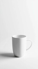 Obraz premium Minimalist White Coffee Mug on Clean Background for Design Use