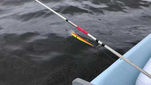 fast moving fishing boat, splashes waves overboard