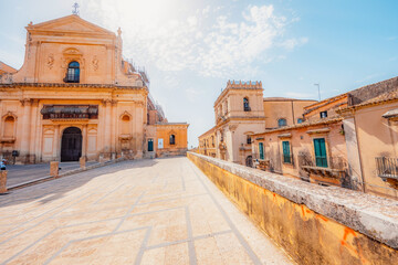 Fototapeta premium view in Noto, with the Basilica Minore di San Nicolo and Palazzo Ducezio, Sicily, Italy.