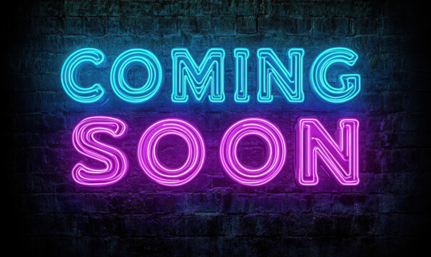 Vibrant neon coming soon sign glowing on a dark