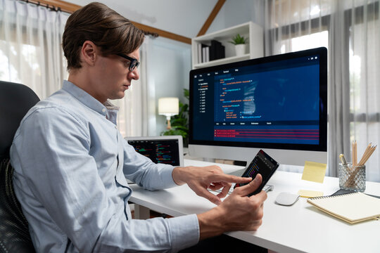 IT developer selecting by point on coding online software development information on tablet comparing with pc and laptop screen with new code program on update version overall system. Pecuniary.