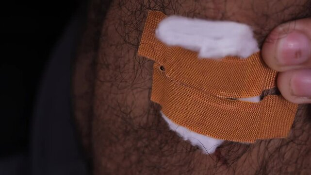 Close up view of a bandage applied on the skin, a common solution to protect wounds, aid healing, and prevent infection of any skin injuries.