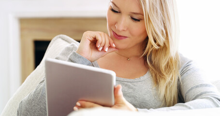 Woman, thinking and tablet on sofa for relax, streaming media and entertainment app on weekend....